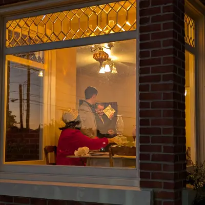 looking in thorugh the bay window a group attmepts to solve a clue from the 1920s actor