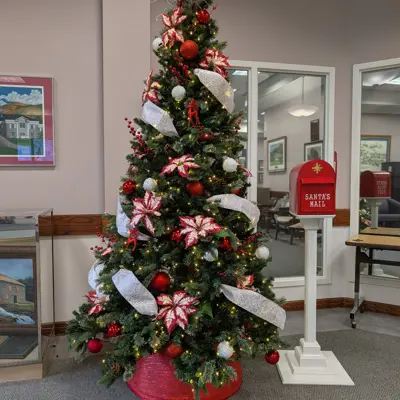 Decorated christmas tree at city hall with santa mail mailbox