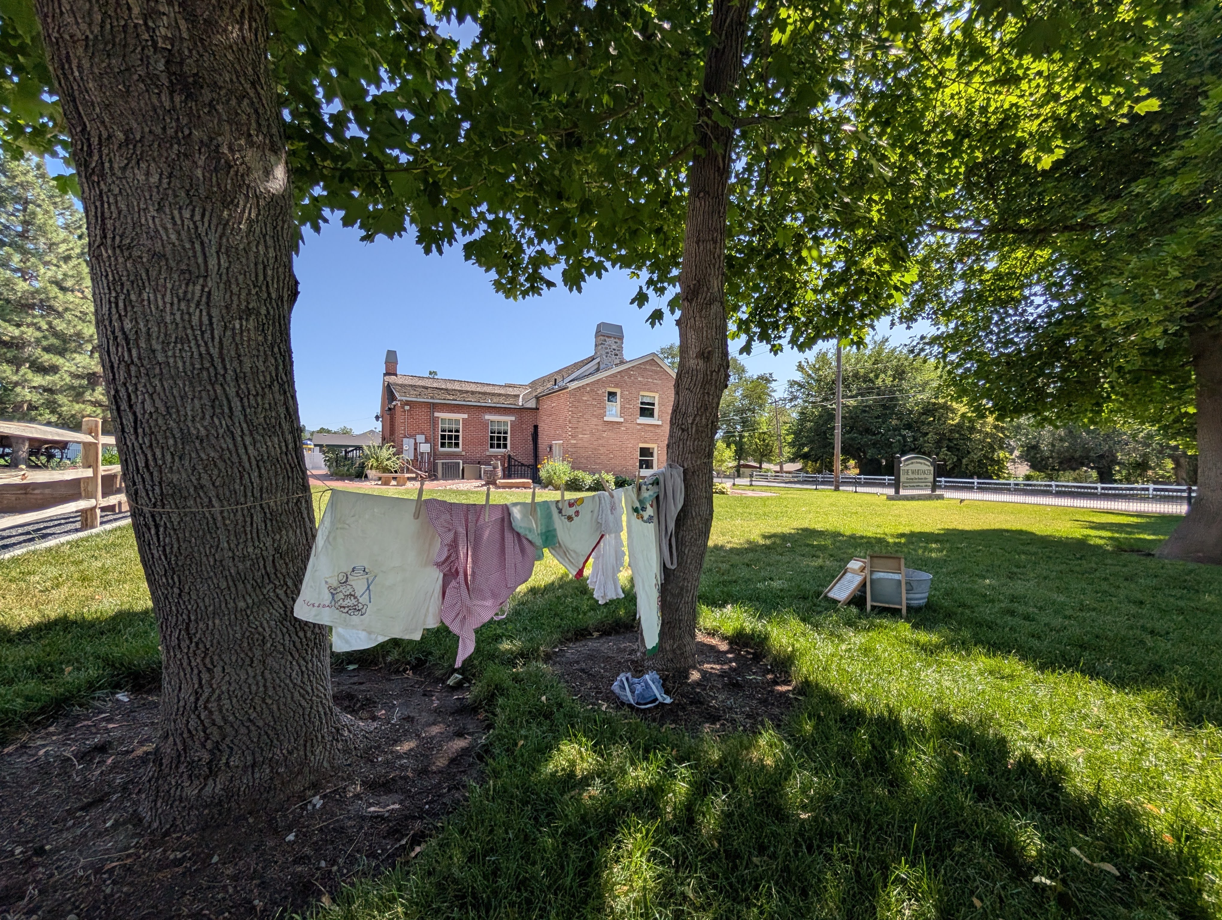 Pioneer clothing just washed and hung to dry on the line between trees outside the whitaker museum